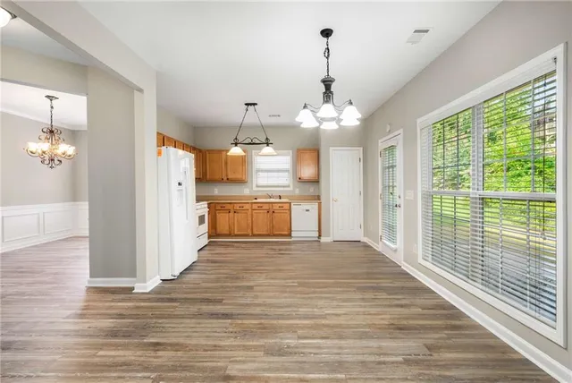 a view of a kitchen from the hallway