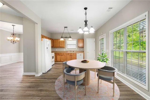 a view of a dining room with furniture window and wooden floor