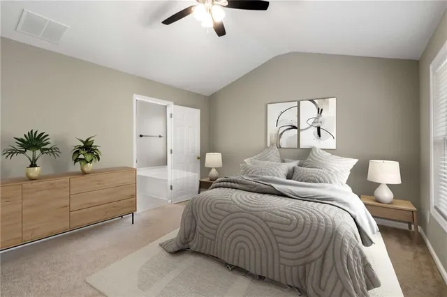 a bedroom with double bed and a potted plant