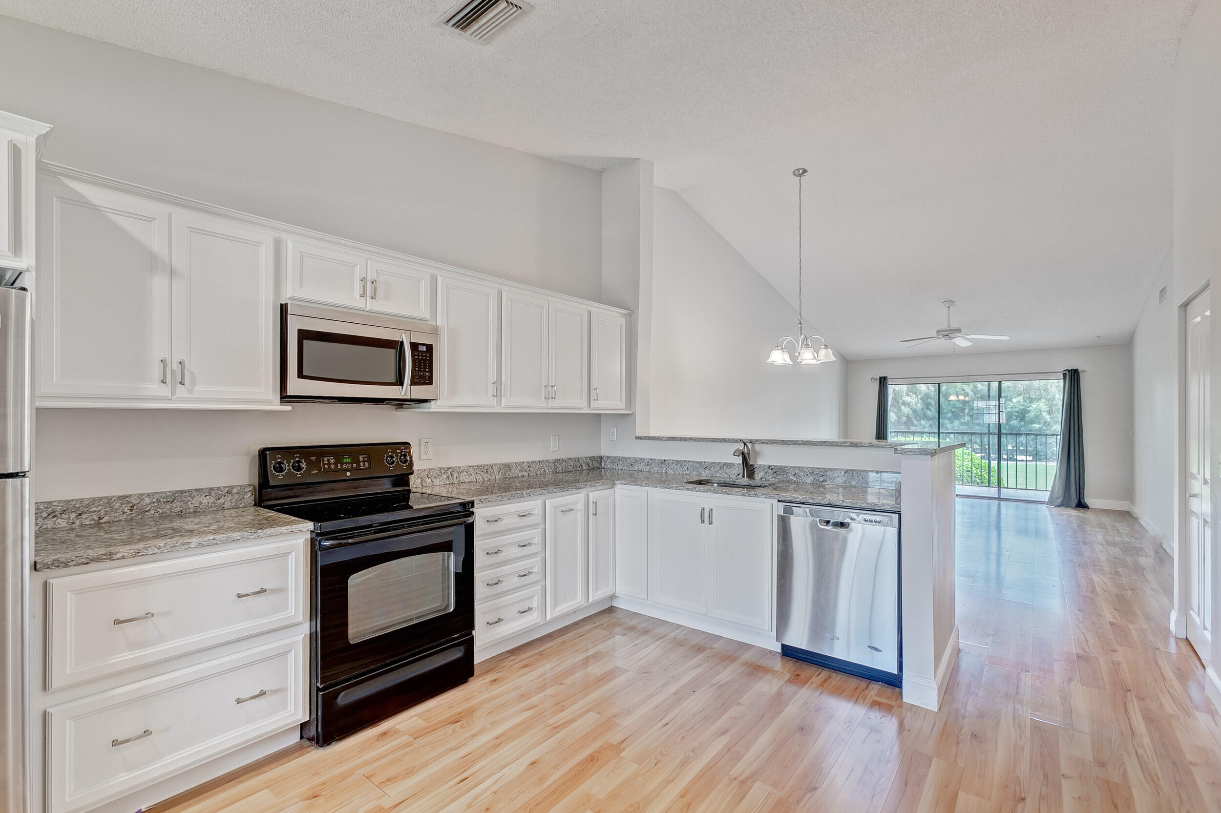 1122 Keystone Drive, Unit D Jupiter, FL 33458 - Photo 1 of 40 Kitchen/Living Rm