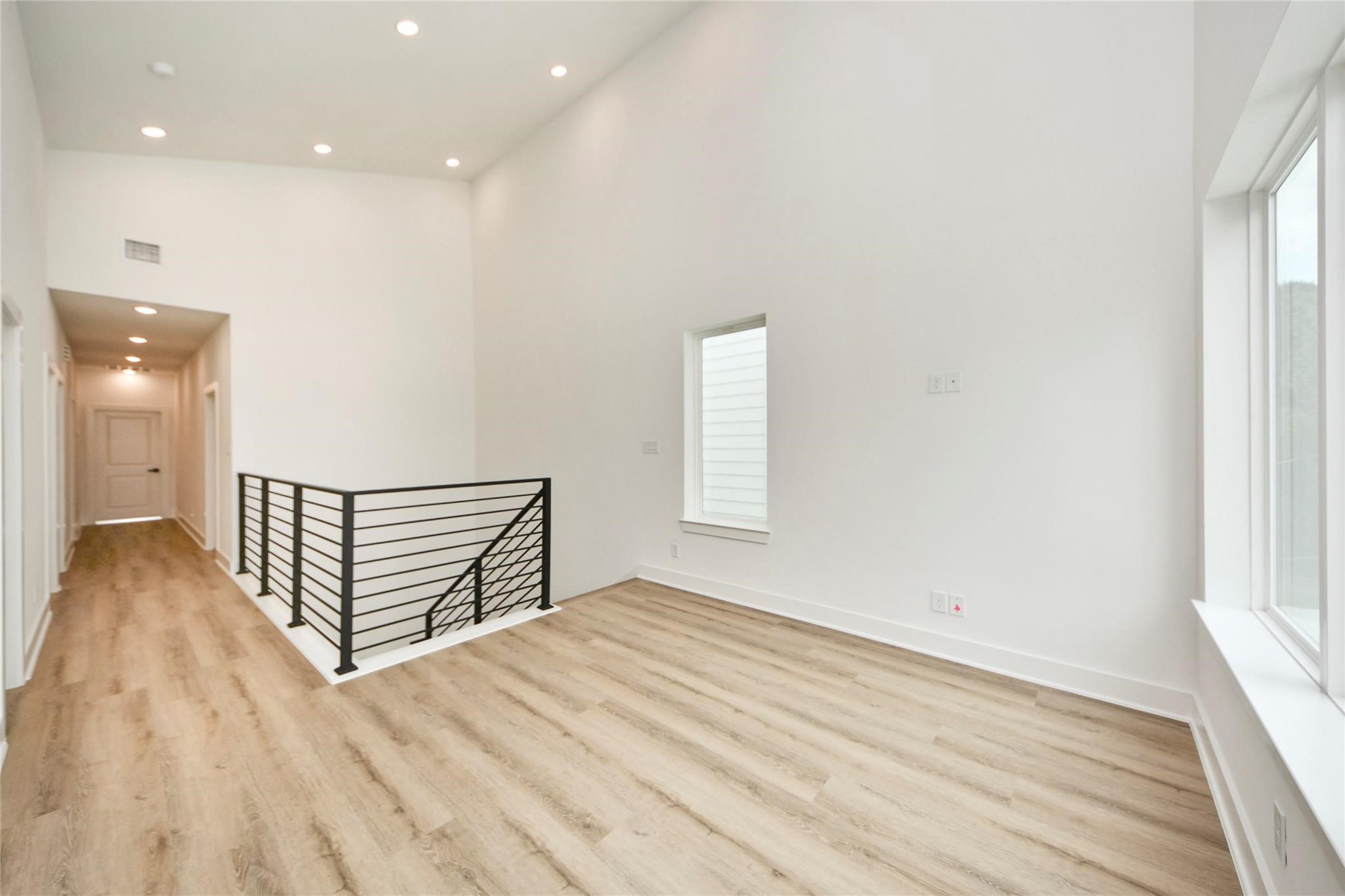 932 South Lane, Unit B Houston, TX 77088 - Photo 4 of 14 a view of a livingroom with wooden floor and window