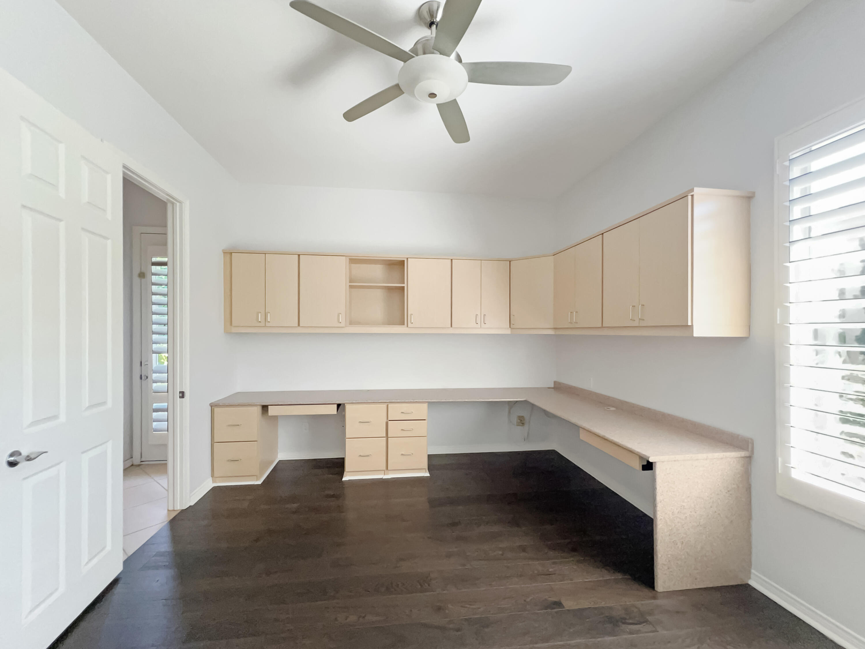 5 Lyon Road Rancho Mirage, CA 92270 - Photo 18 of 36 a view of an empty room with a window and wooden floor