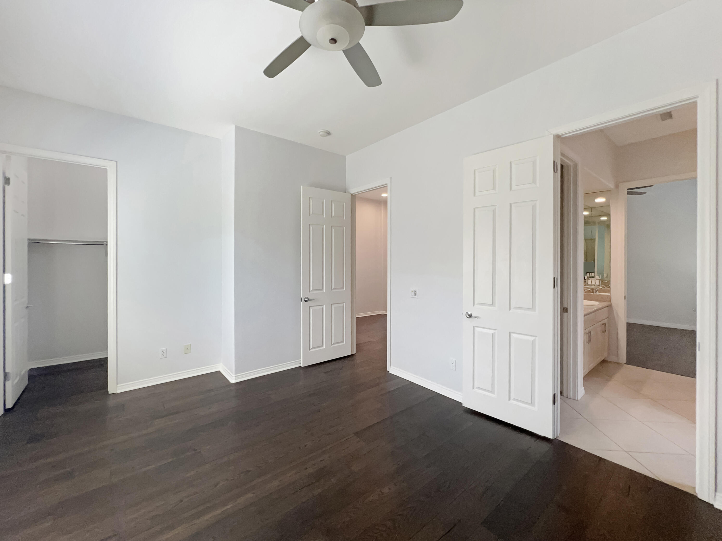 5 Lyon Road Rancho Mirage, CA 92270 - Photo 19 of 36 a view of an empty room with wooden floor