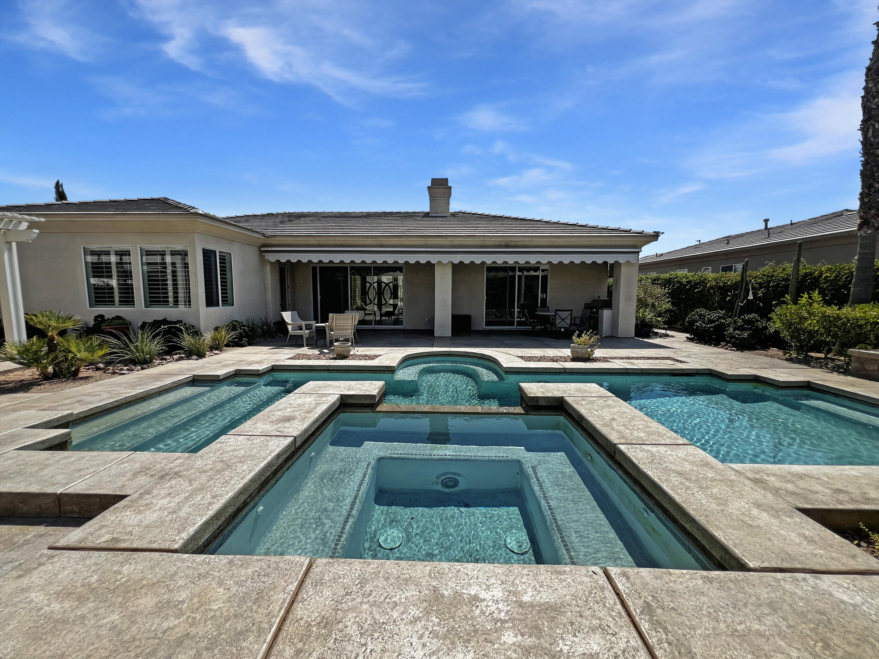 5 Lyon Road Rancho Mirage, CA 92270 - Photo 26 of 36 a view of a house with swimming pool and sitting area