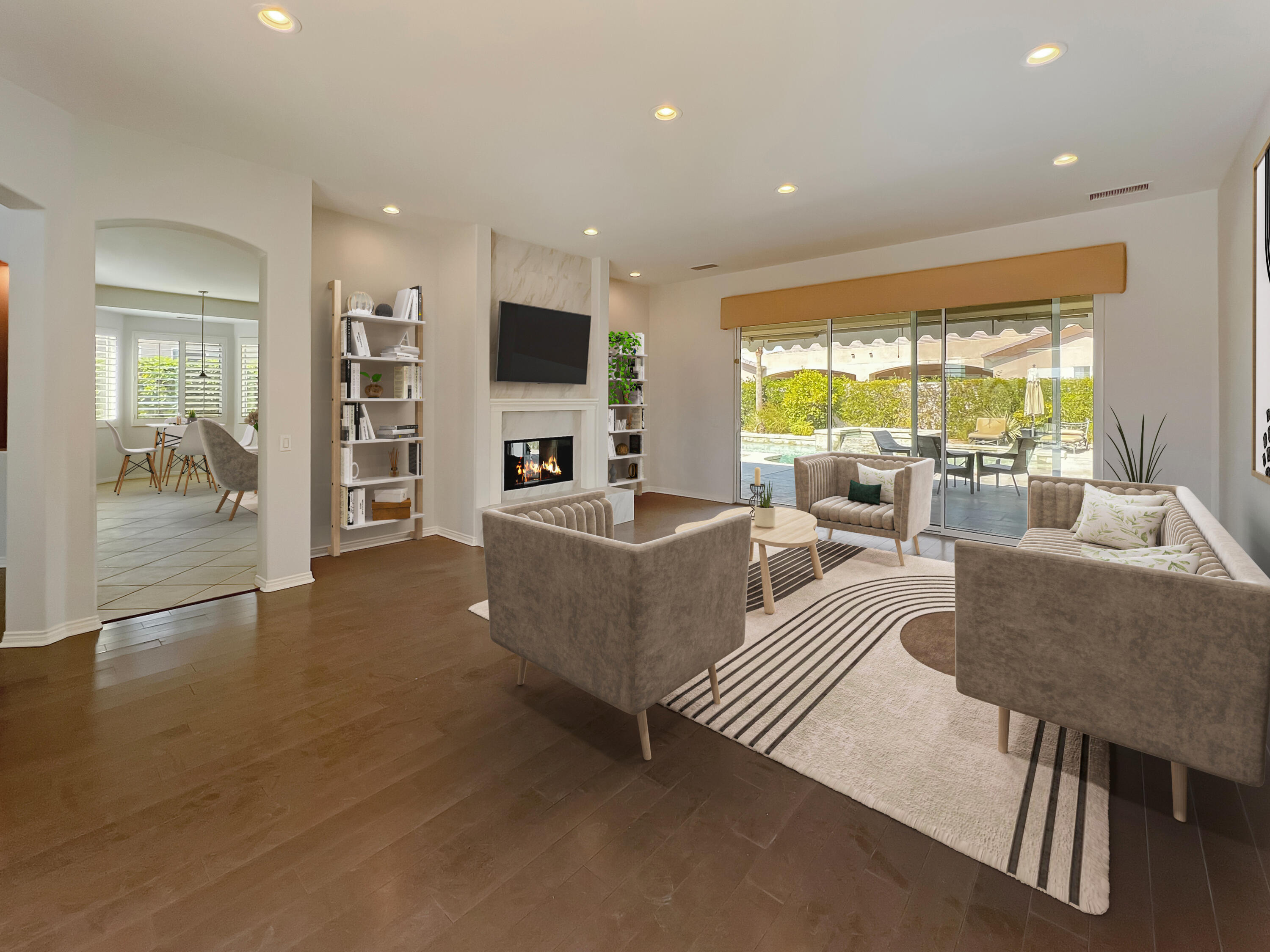 5 Lyon Road Rancho Mirage, CA 92270 - Photo 3 of 36 a living room with fireplace furniture and a flat screen tv