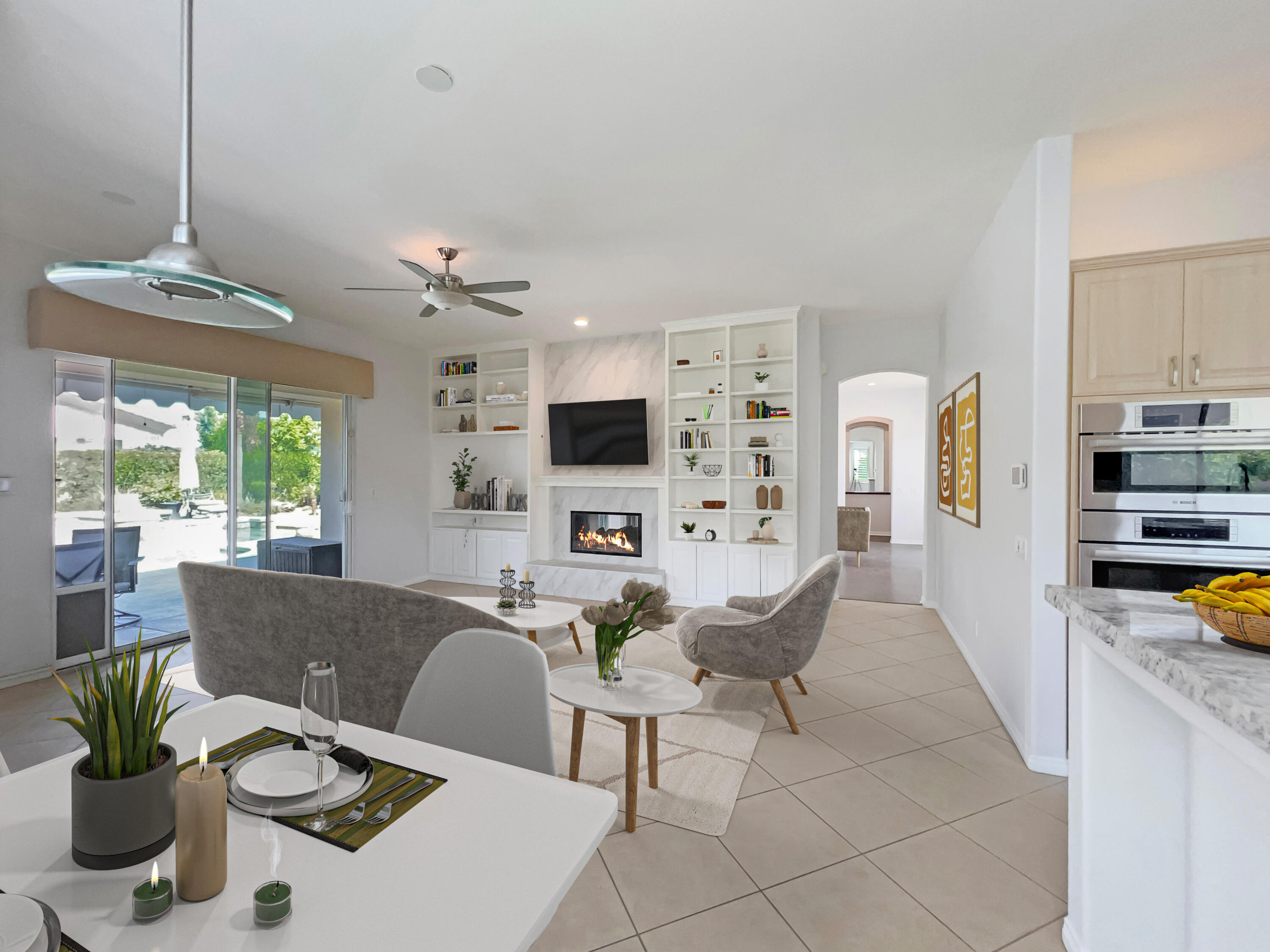 5 Lyon Road Rancho Mirage, CA 92270 - Photo 6 of 36 a living room with furniture a flat screen tv and a large window