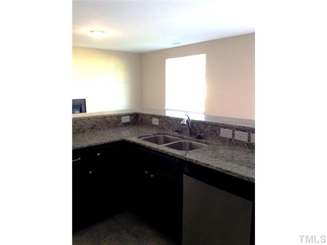 3513 Eastern Branch Road Raleigh, NC 27610 - Photo 6 of 14 a kitchen with a sink and a window