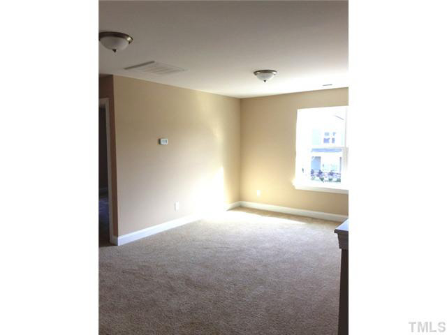 3513 Eastern Branch Road Raleigh, NC 27610 - Photo 8 of 14 a view of a big room with windows and closet