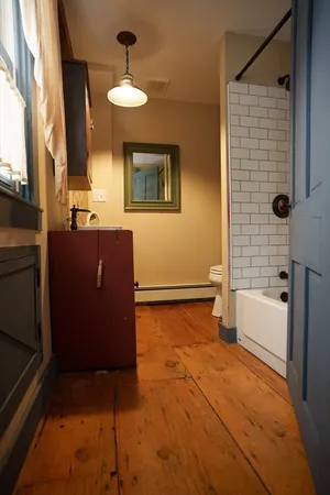 a bathroom with a bathtub and a sink
