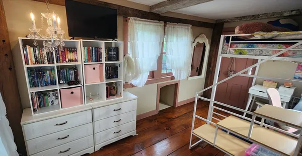 a room with cabinets and a flat screen tv