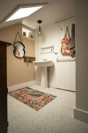 a view of a refrigerator in kitchen and wooden floor