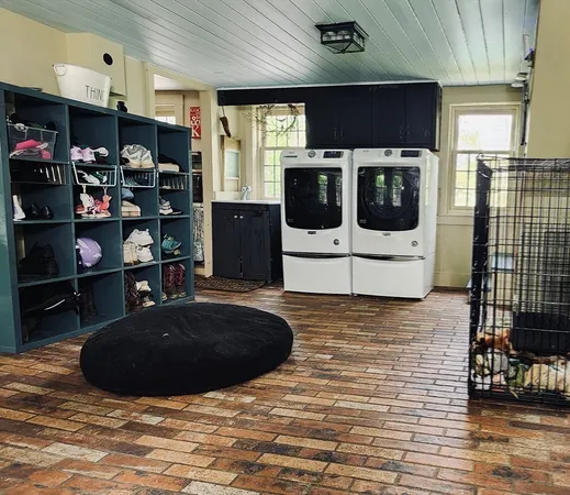 a kitchen with stainless steel appliances granite countertop a stove a microwave and a refrigerator