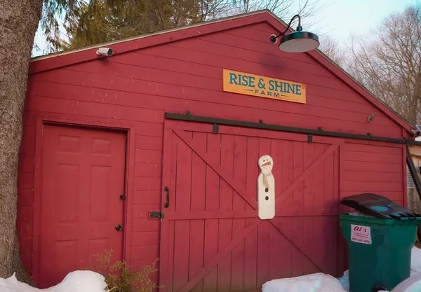 a view of a red door and brick wall