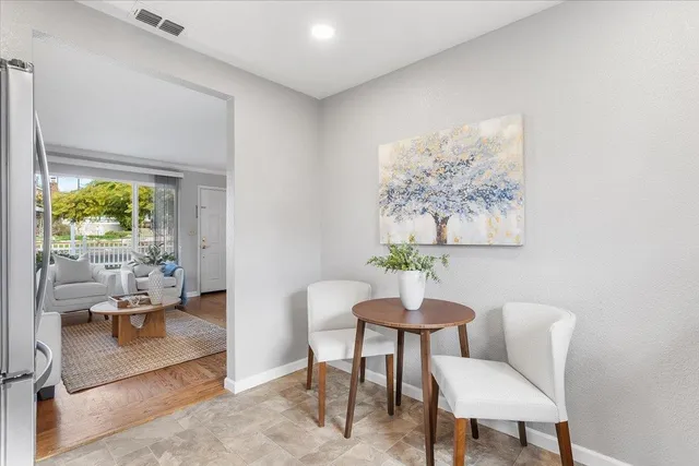 a view of a livingroom with furniture and a potted plant