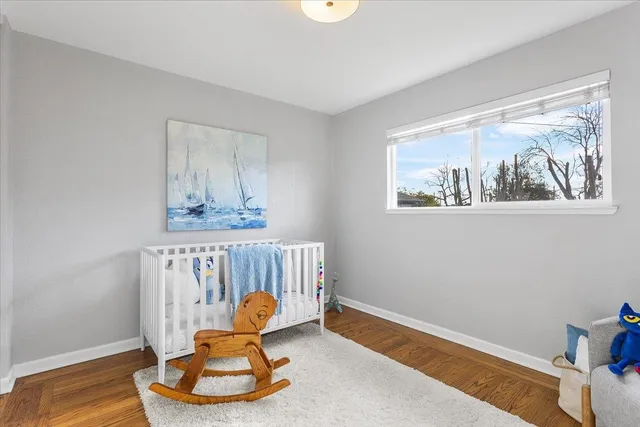 a bedroom with furniture and a window