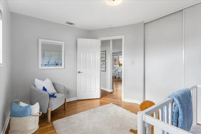 a white toilet sitting next to a white bath tub