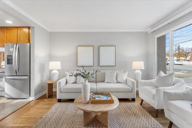 a living room with furniture and a lamp