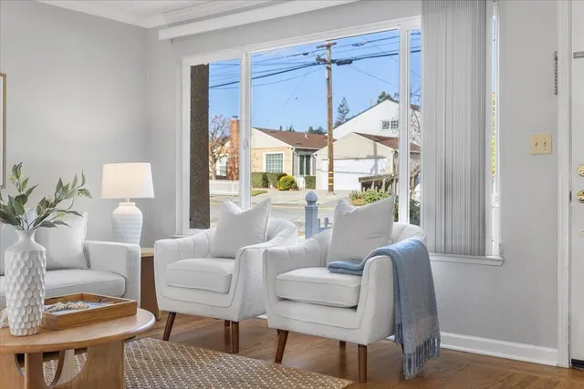 a living room with furniture and a window