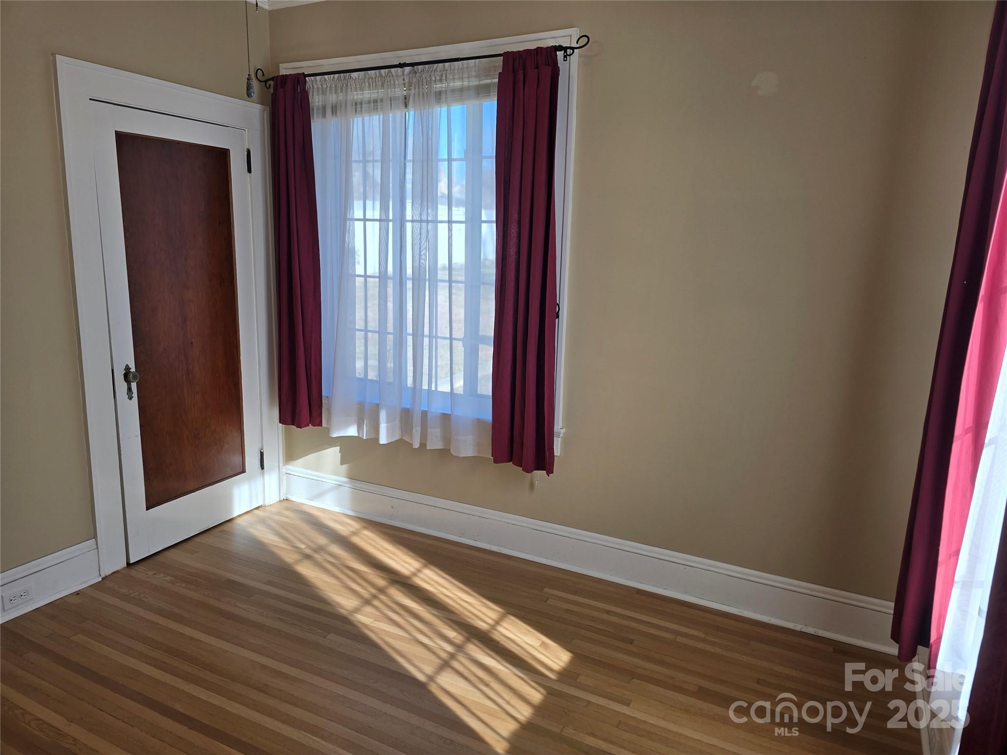 274 North 4th Street Albemarle, NC 28001 - Photo 19 of 44 a view of a room with wooden floor and a window