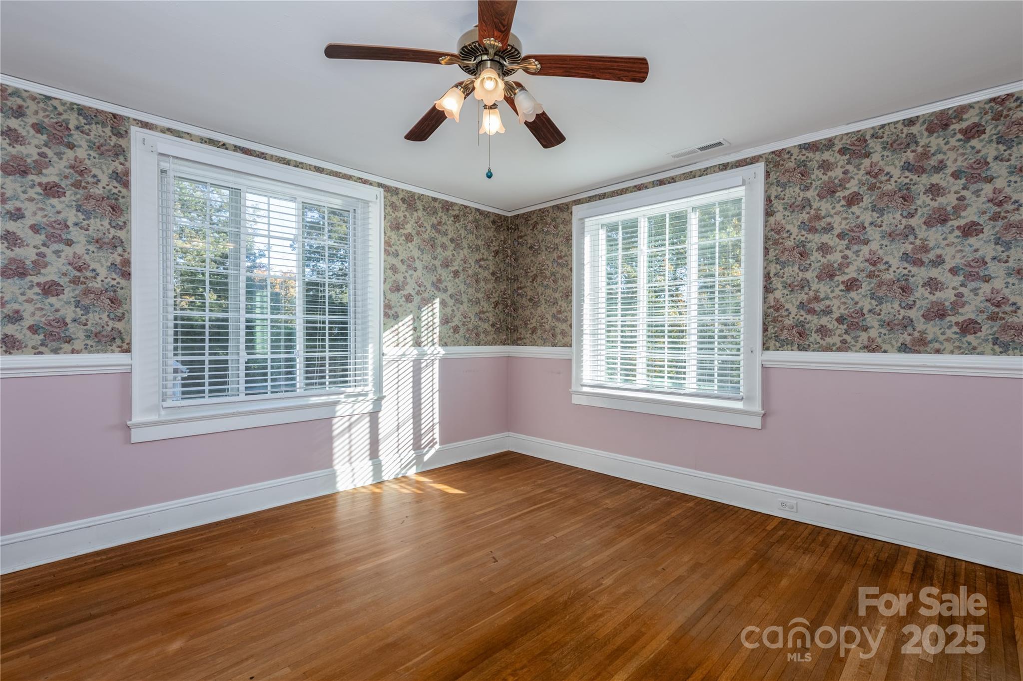 274 North 4th Street Albemarle, NC 28001 - Photo 25 of 44 a view of an empty room with wooden floor and a window