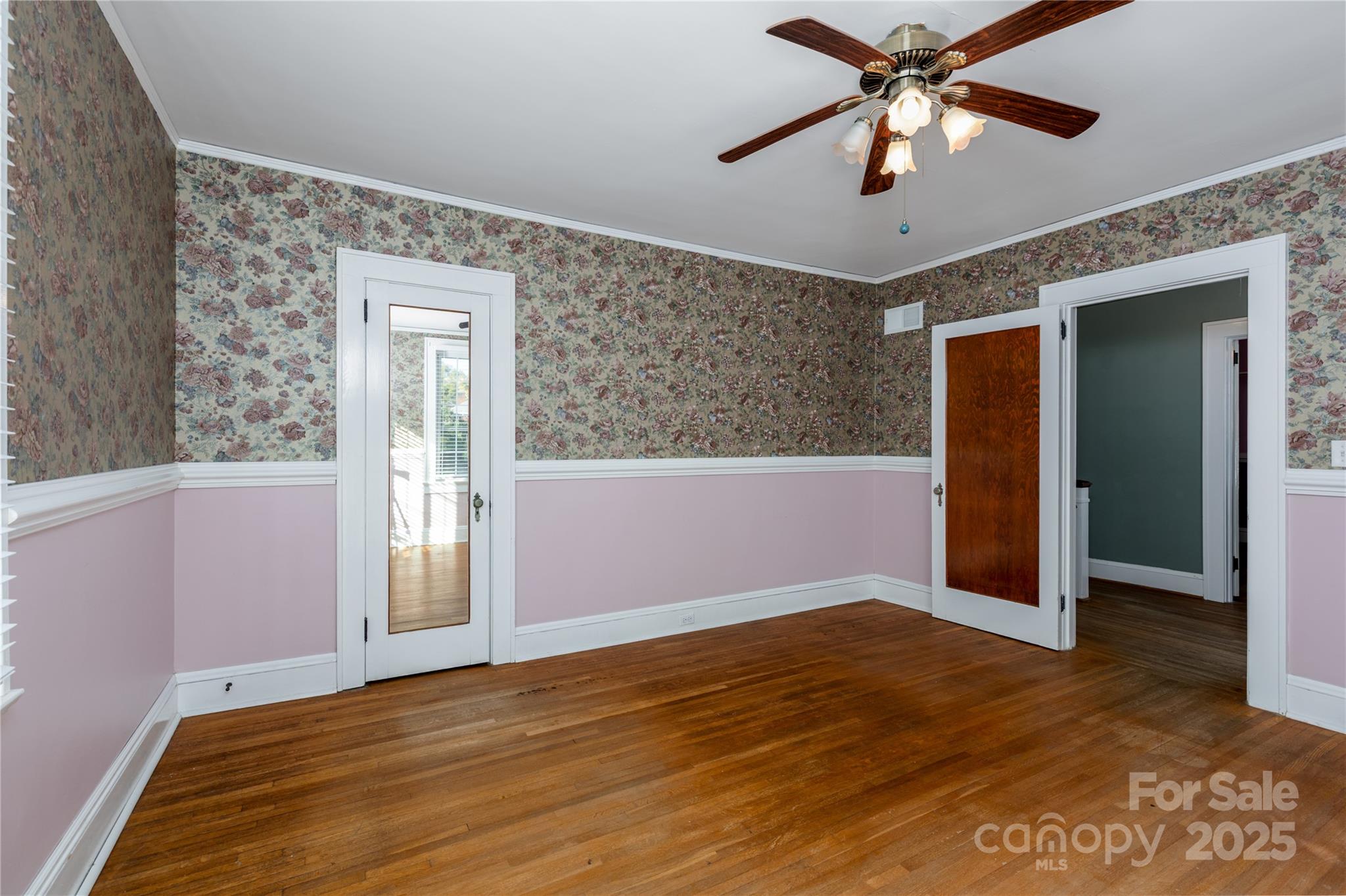 274 North 4th Street Albemarle, NC 28001 - Photo 26 of 44 an empty room with wooden floor closet and windows
