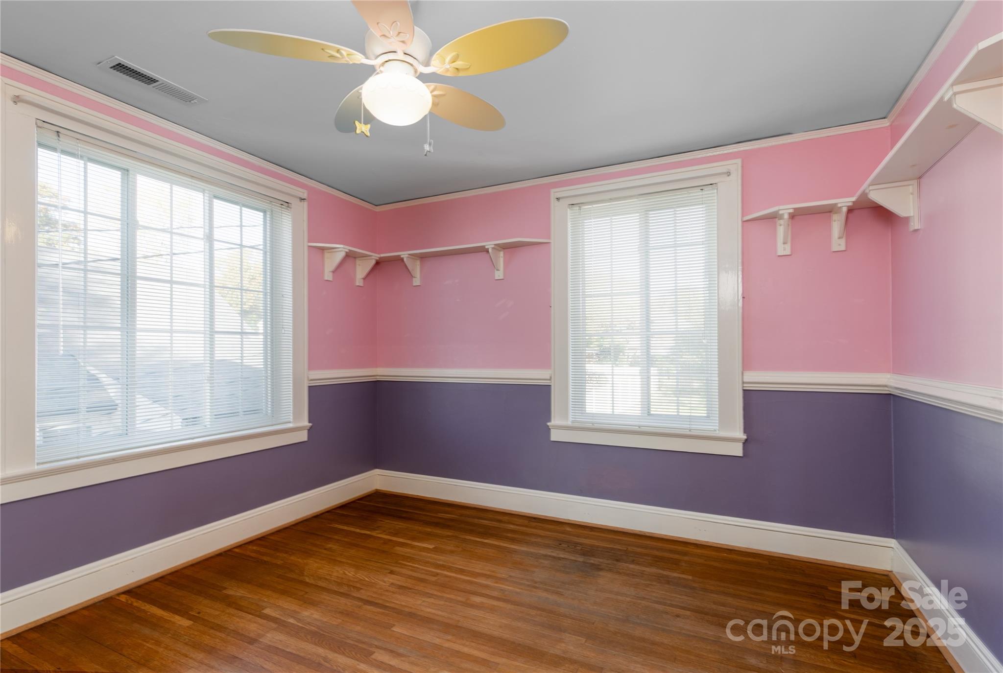 274 North 4th Street Albemarle, NC 28001 - Photo 28 of 44 a view of an empty room with wooden floor and a window
