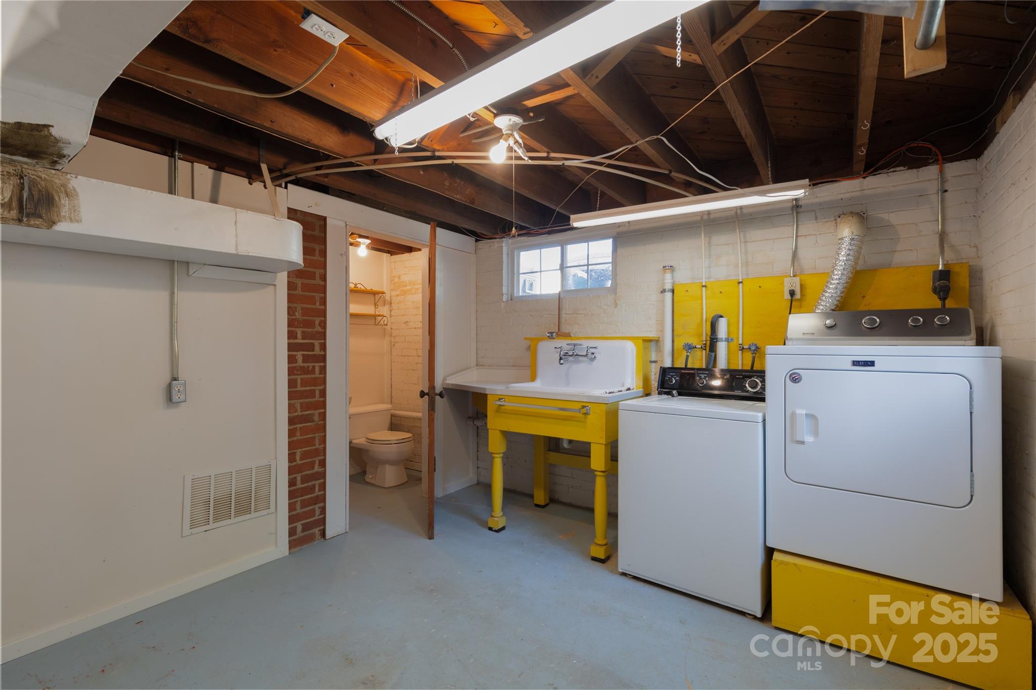 274 North 4th Street Albemarle, NC 28001 - Photo 35 of 44 a view of storage and utility room with washer and dryer
