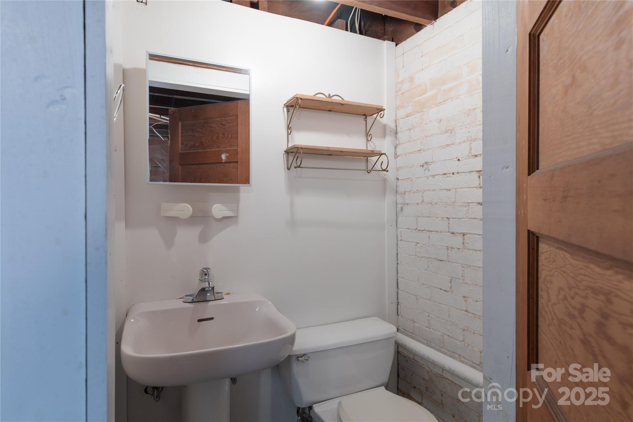 274 North 4th Street Albemarle, NC 28001 - Photo 36 of 44 a bathroom with a sink a toilet and shower