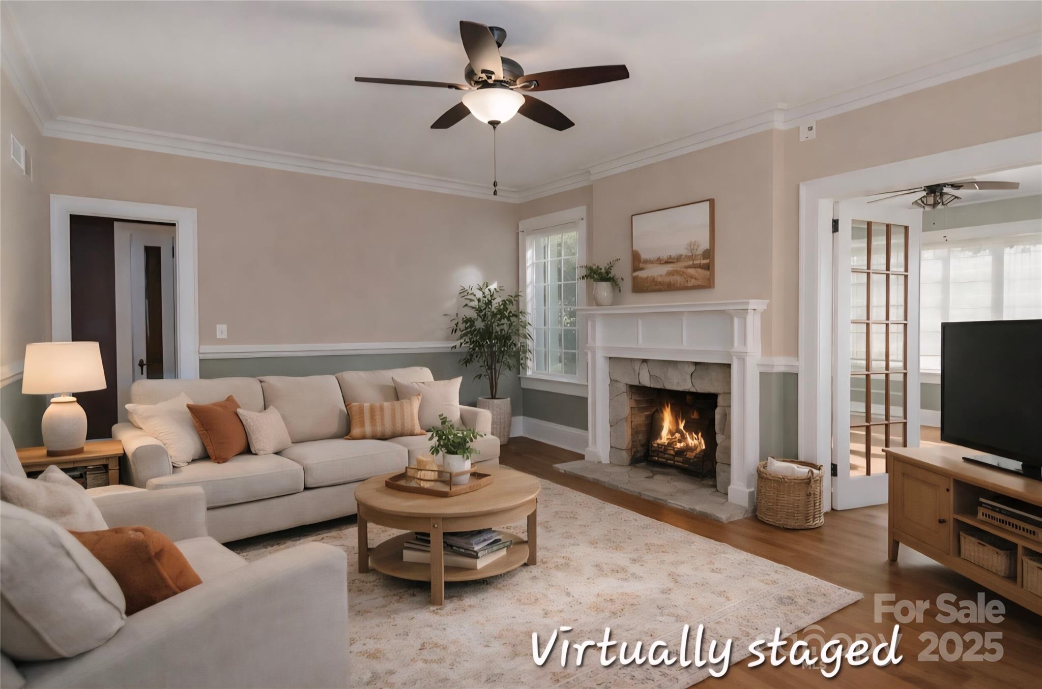 274 North 4th Street Albemarle, NC 28001 - Photo 6 of 44 a living room with furniture a flat screen tv and a fireplace