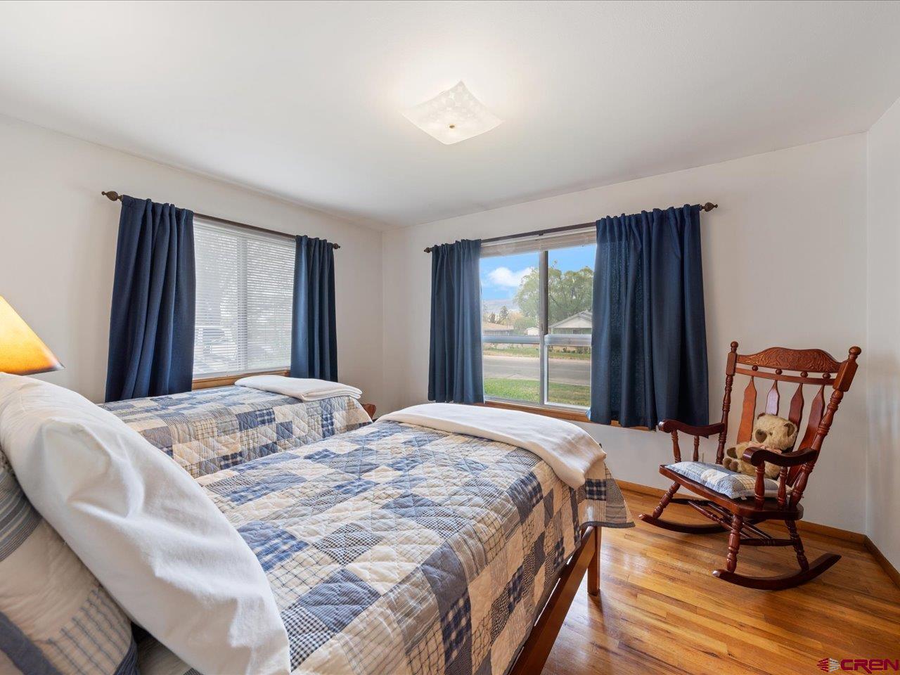 640 East 3rd Street Delta, CO 81416 - Photo 13 of 31 a bedroom with a bed chair and window