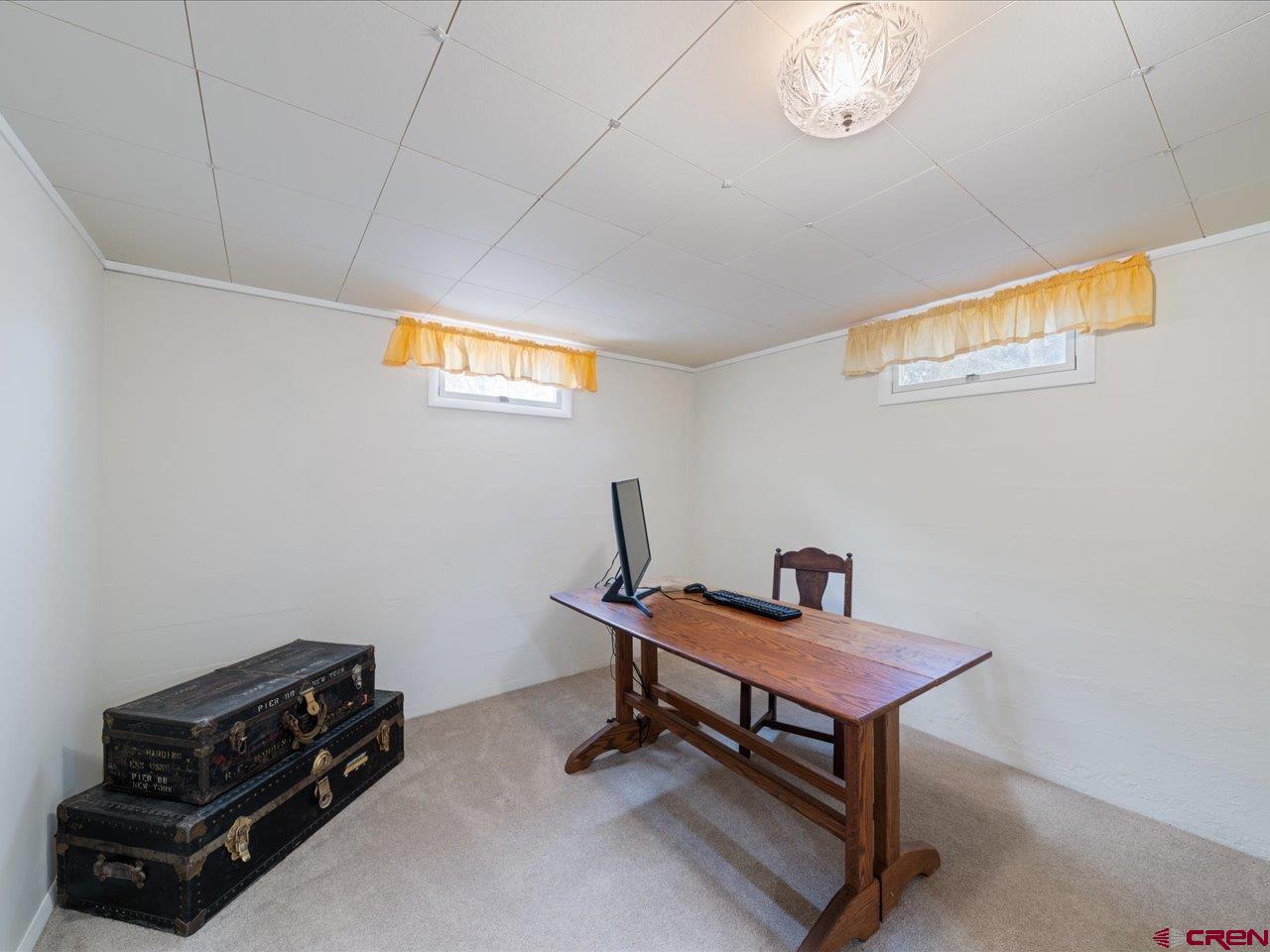 640 East 3rd Street Delta, CO 81416 - Photo 23 of 31 a room with furniture and a window