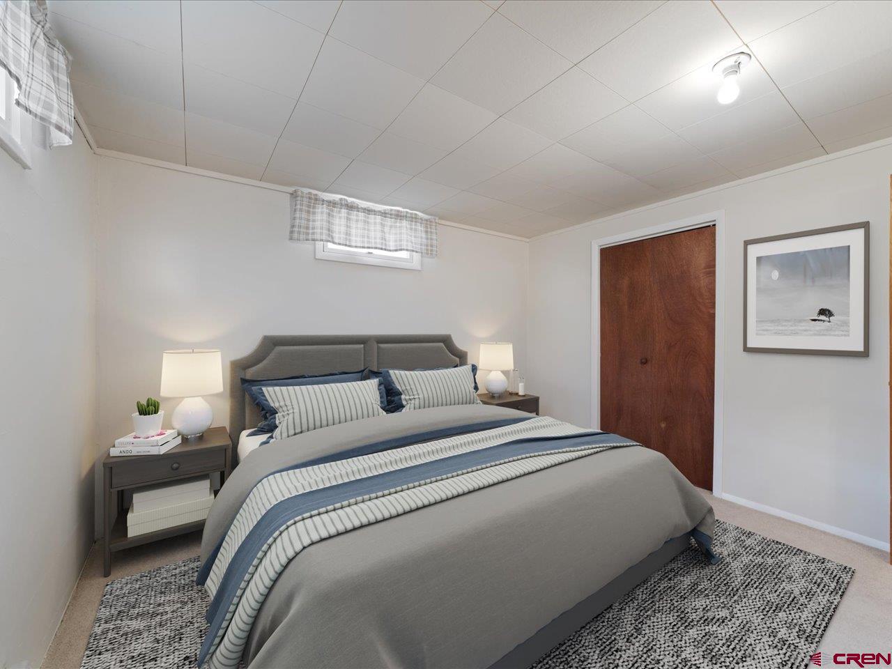 640 East 3rd Street Delta, CO 81416 - Photo 27 of 31 a bedroom with bed and a window
