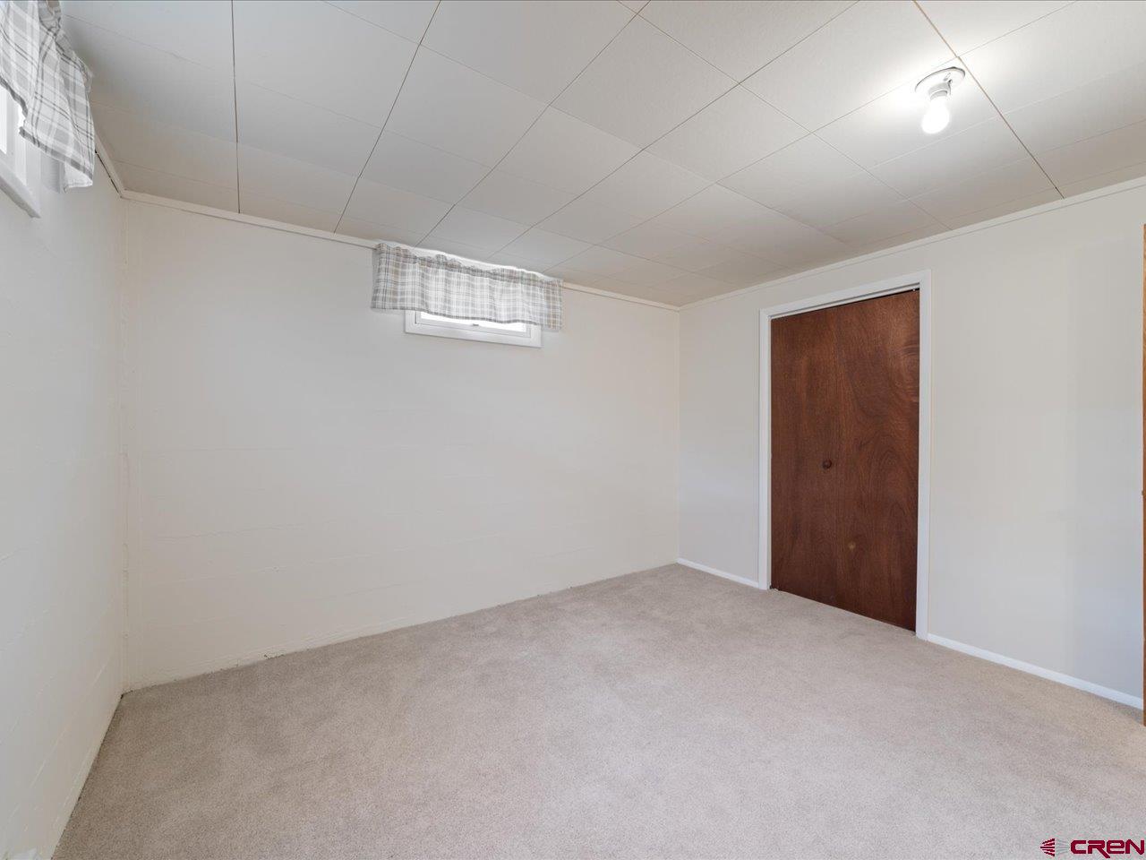 640 East 3rd Street Delta, CO 81416 - Photo 28 of 31 an empty room with windows and closet