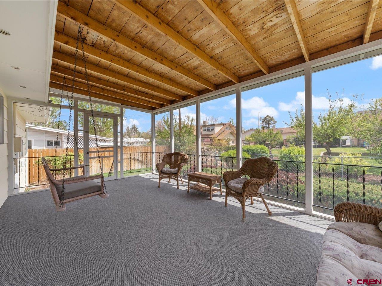 640 East 3rd Street Delta, CO 81416 - Photo 30 of 31 a living room with furniture and floor to ceiling windows