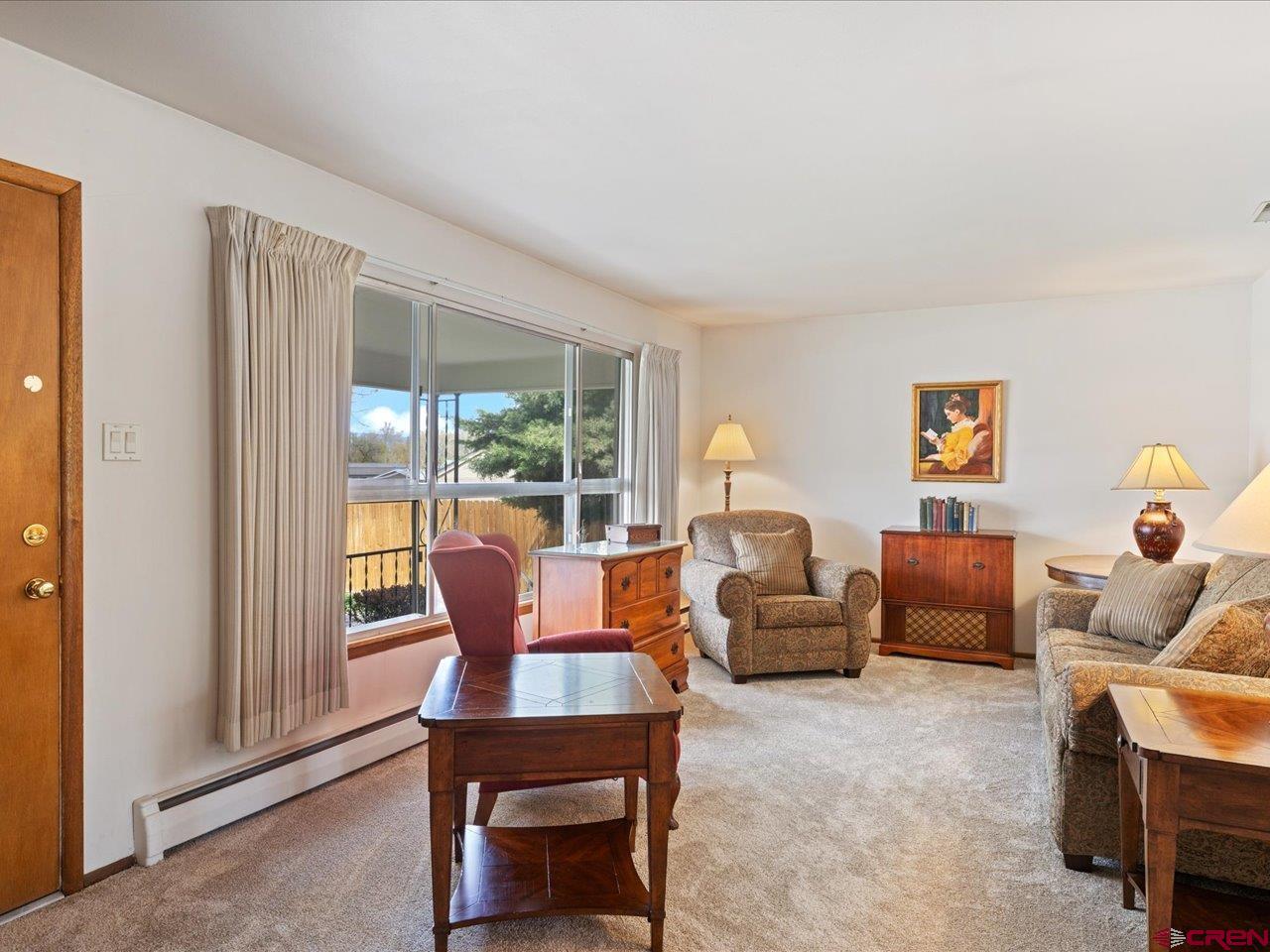 640 East 3rd Street Delta, CO 81416 - Photo 5 of 31 a living room with furniture and a window