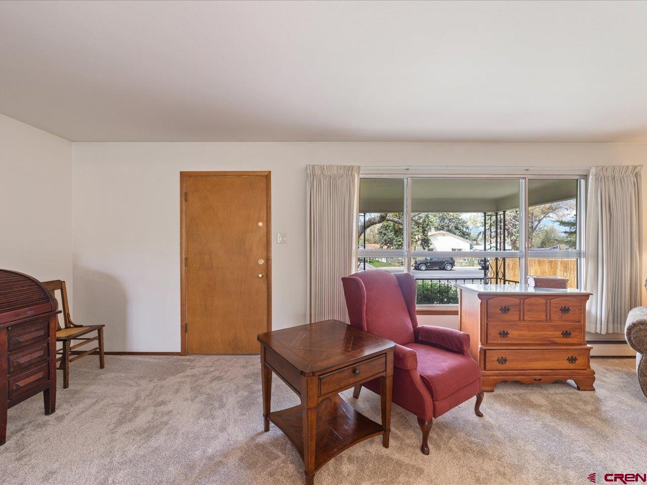 640 East 3rd Street Delta, CO 81416 - Photo 6 of 31 a living room with furniture and a window