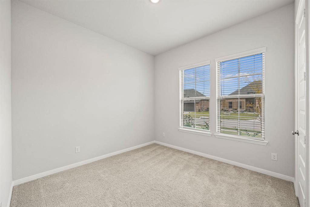 1506 Red Clover Avenue Van Alstyne, TX 75495 - Photo 16 of 24 an empty room with a window
