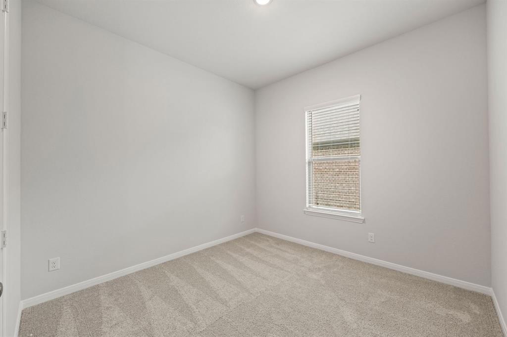 1506 Red Clover Avenue Van Alstyne, TX 75495 - Photo 17 of 24 an empty room with a window