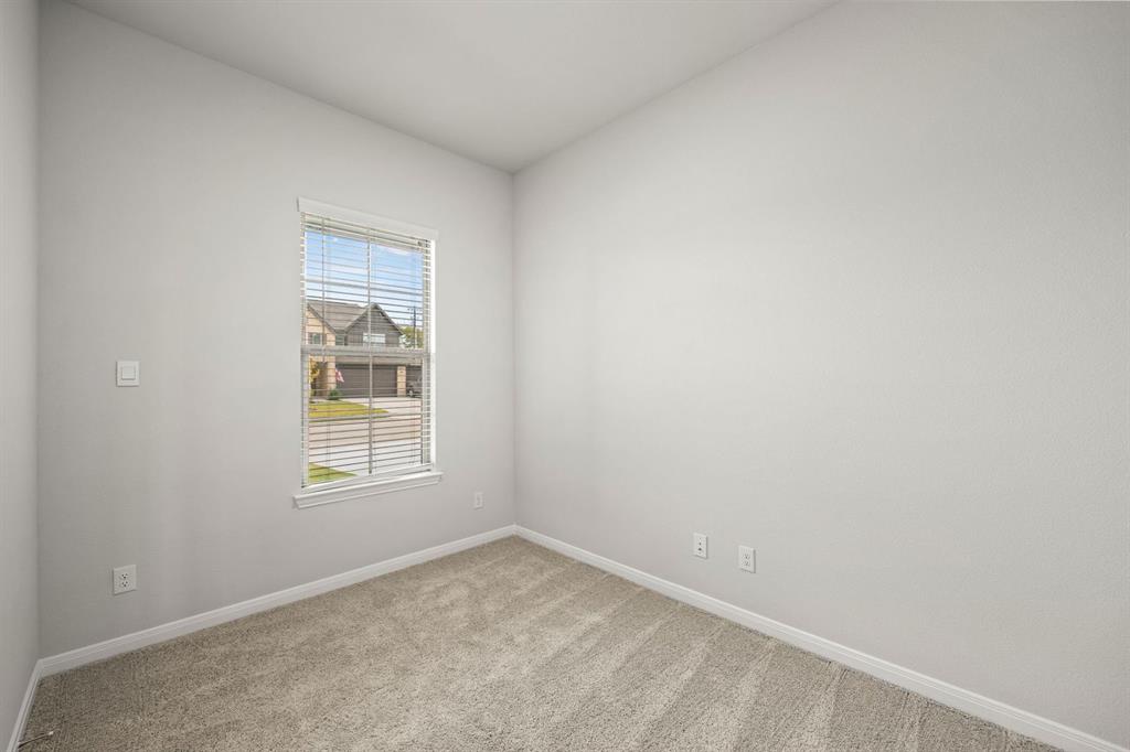 1506 Red Clover Avenue Van Alstyne, TX 75495 - Photo 21 of 24 an empty room with a window