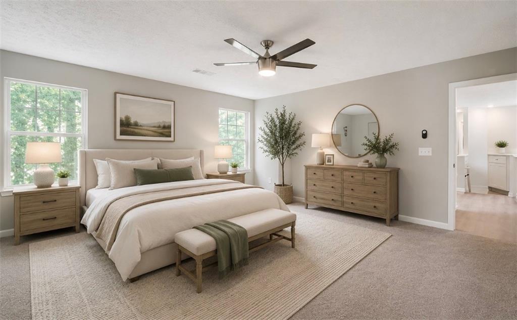 4110 Ridgebrook Bend Cumming, GA 30028 - Photo 32 of 49 a spacious bedroom with a bed and a chandelier
