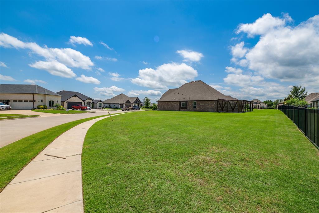 2011 Spieth Street Granbury, TX 76048 - Photo 29 of 35 View of yard with a residential view