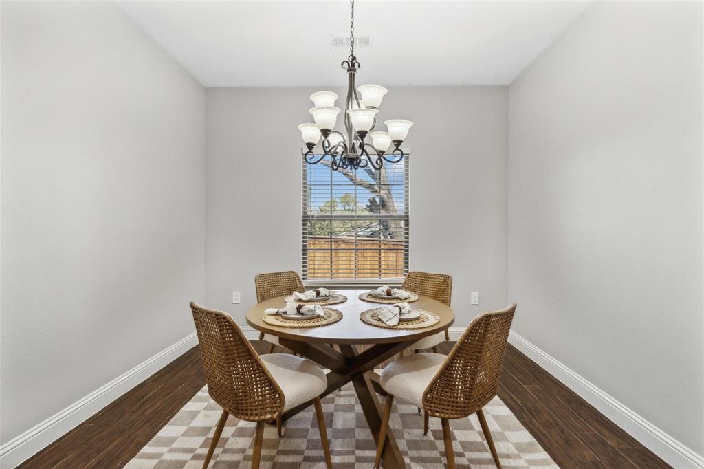 4662 Barbara Road River Oaks, TX 76114 - Photo 7 of 14 Recessed room with wood-finish flooring, a multi-light chandelier, and a window with blinds