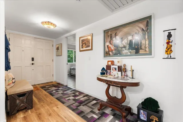 a bedroom with furniture and wall paintings