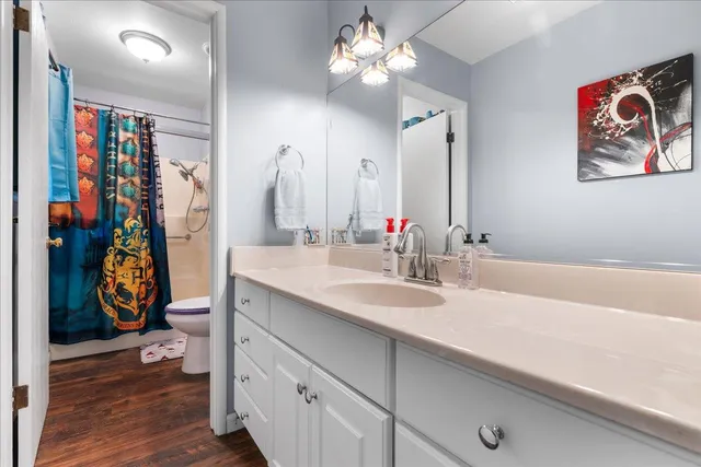 a bathroom with a sink a vanity and a mirror