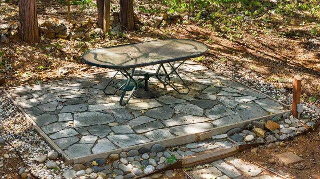 an aerial view of a residential houses with yard