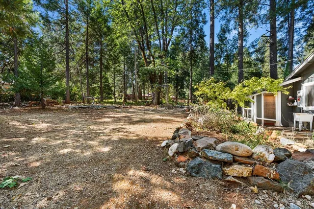 a view of a house with a tree in the background