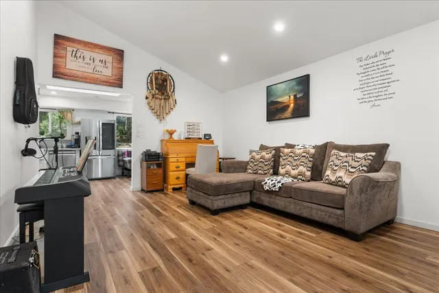 a living room with furniture and a table