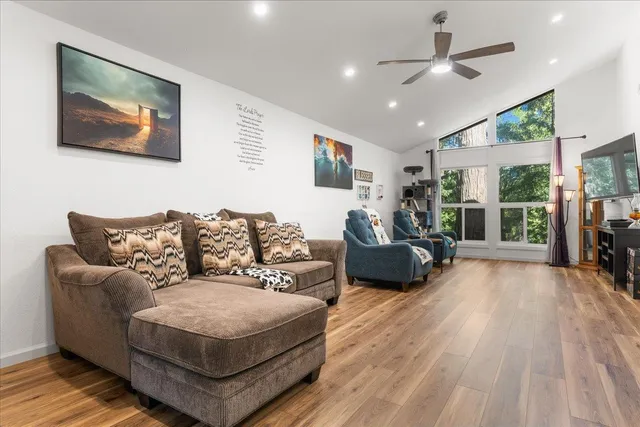 a living room with furniture and a large window