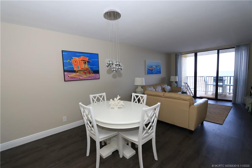 7380 South Ocean Drive, Unit 621 Jensen Beach, FL 34957 - Photo 15 of 48 a view of a dining room with furniture wooden floor and a window