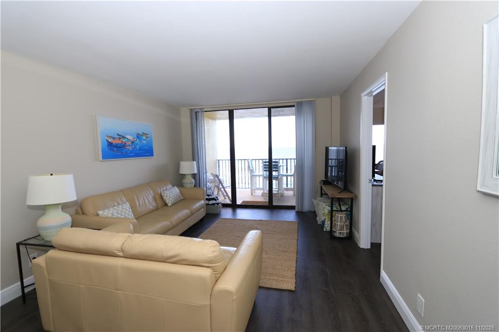 7380 South Ocean Drive, Unit 621 Jensen Beach, FL 34957 - Photo 17 of 48 a living room with furniture and a large window
